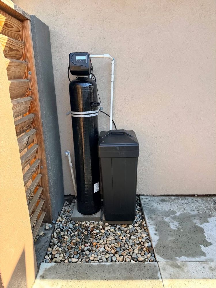 Water softener and filter installed outdoors at a Fresno home by Nick Alvarado